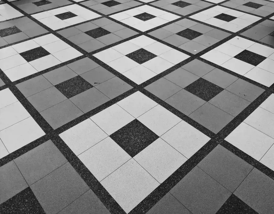 Cream and gold marble porcelain floor and wall tile in a Justice home