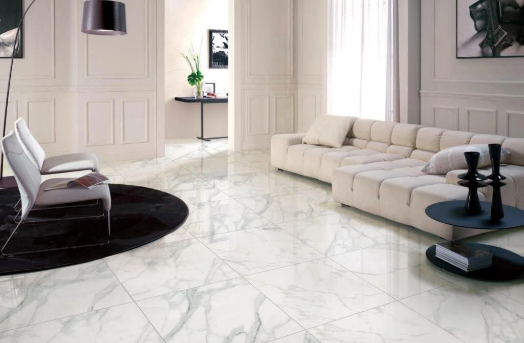 Large-format white Carrara marble porcelain floor in a Summit living room